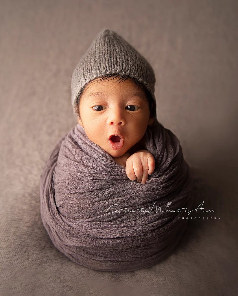 Baby boy wrapped up for his newborn photoshoot in Sydney