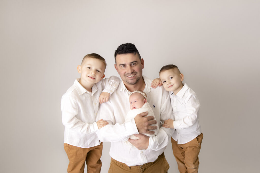 Happy Father's Day! Father and his three children photographed at Capture The Moment By Ana Photography in Sydney.